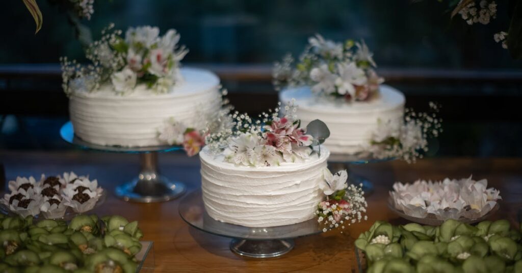 Delicate white cakes with floral decorations, perfect for weddings or special occasions.